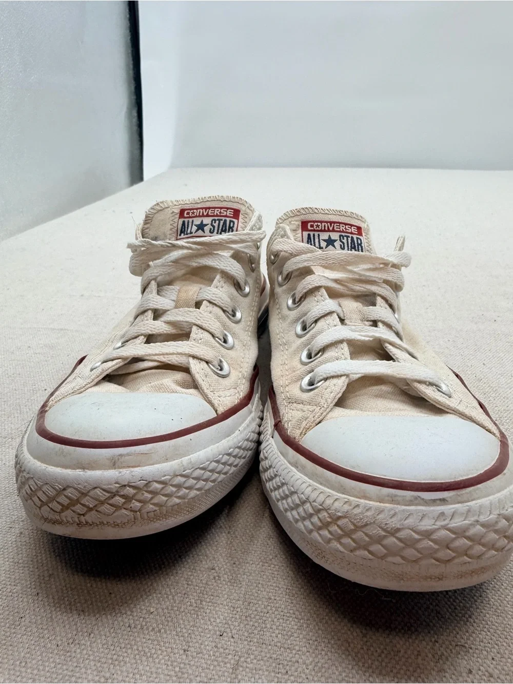 Converse Low Top Sneakers in Cream with Red Trim